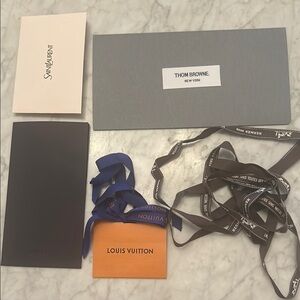 Five piece lucky stationary set, including Louis Vuitton, Hermes, and more